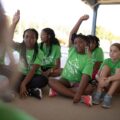 GOTR girls at practice raising their hands