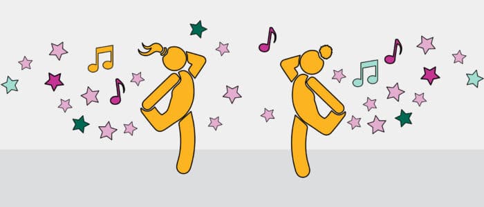 Two girls dancing to music
