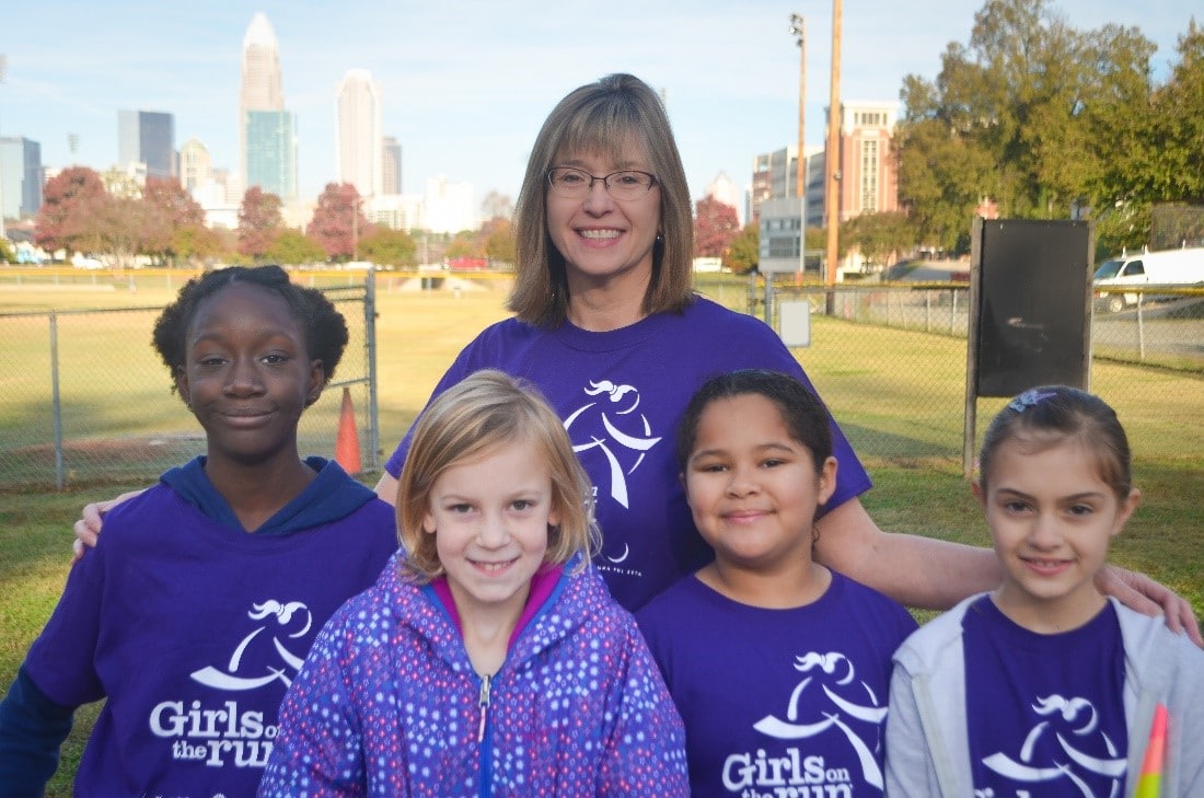 GOTRI CEO Liz Kunz with GOTR girls (reflecting how its going) vs how it started.