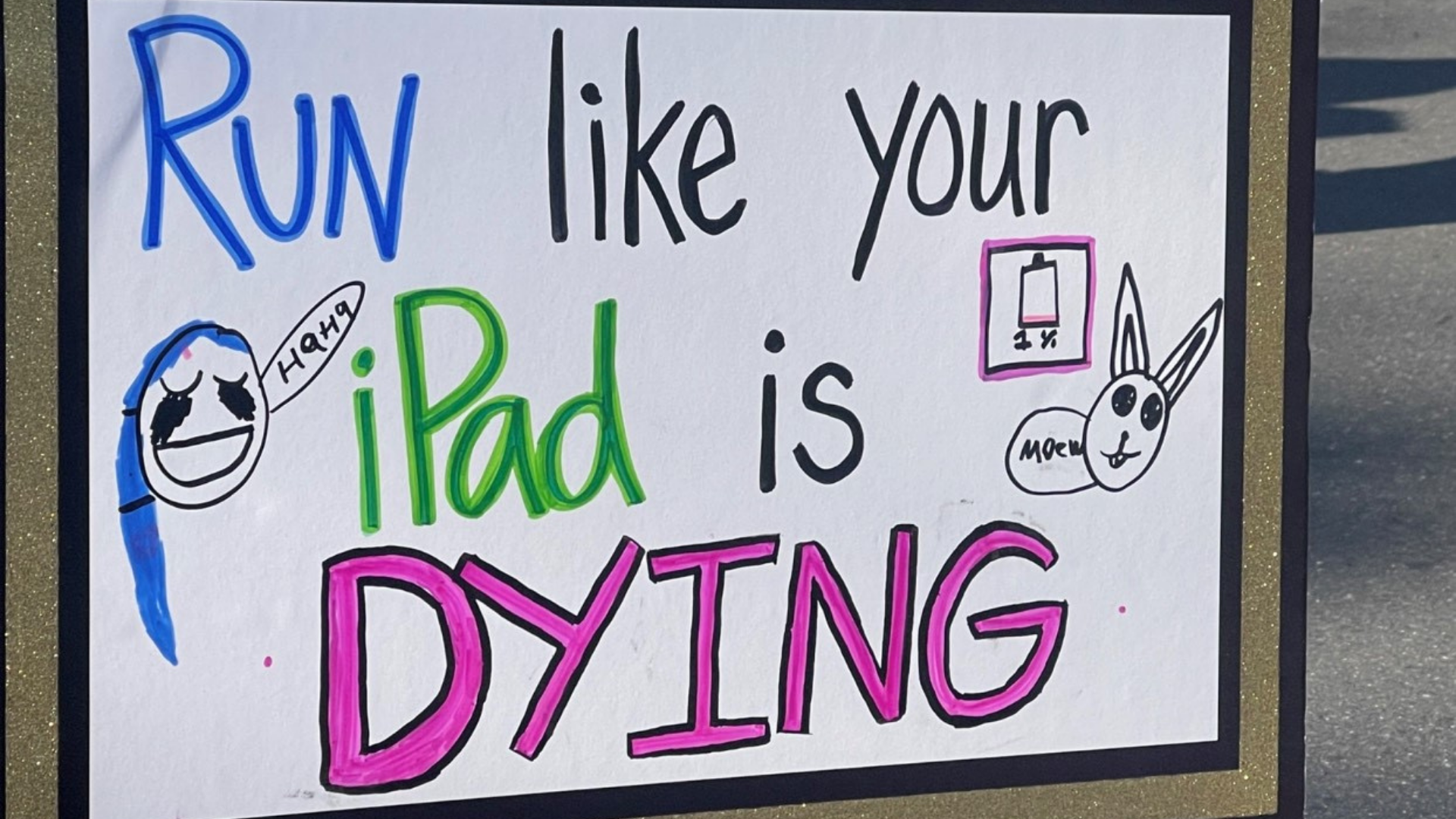 Hand-drawn fantastic 5K sign that says 'run like your Ipad is dying'