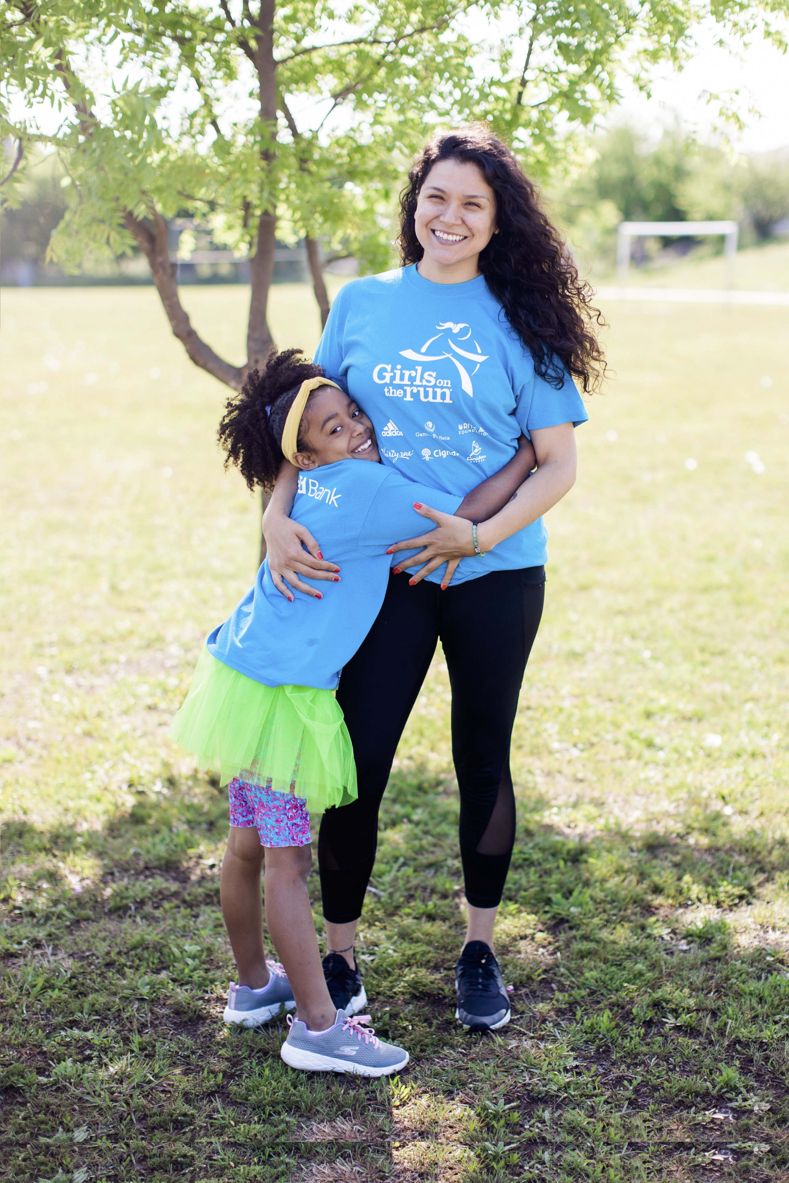 GOTR Coach smiling with a GOTR girl