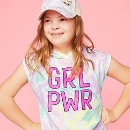 Young happy girl in colorful hat and t-shirt