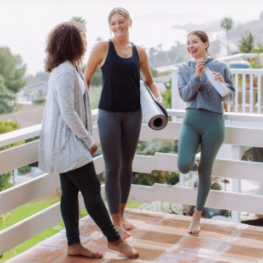 Three women outside in activewear