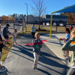 GOTR girl crossing the finish line