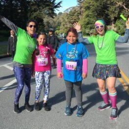 Two GOTR coaches and two GOTR girls at 5K event