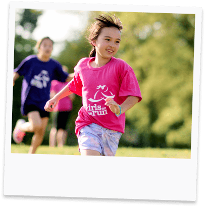 A girl running in a field