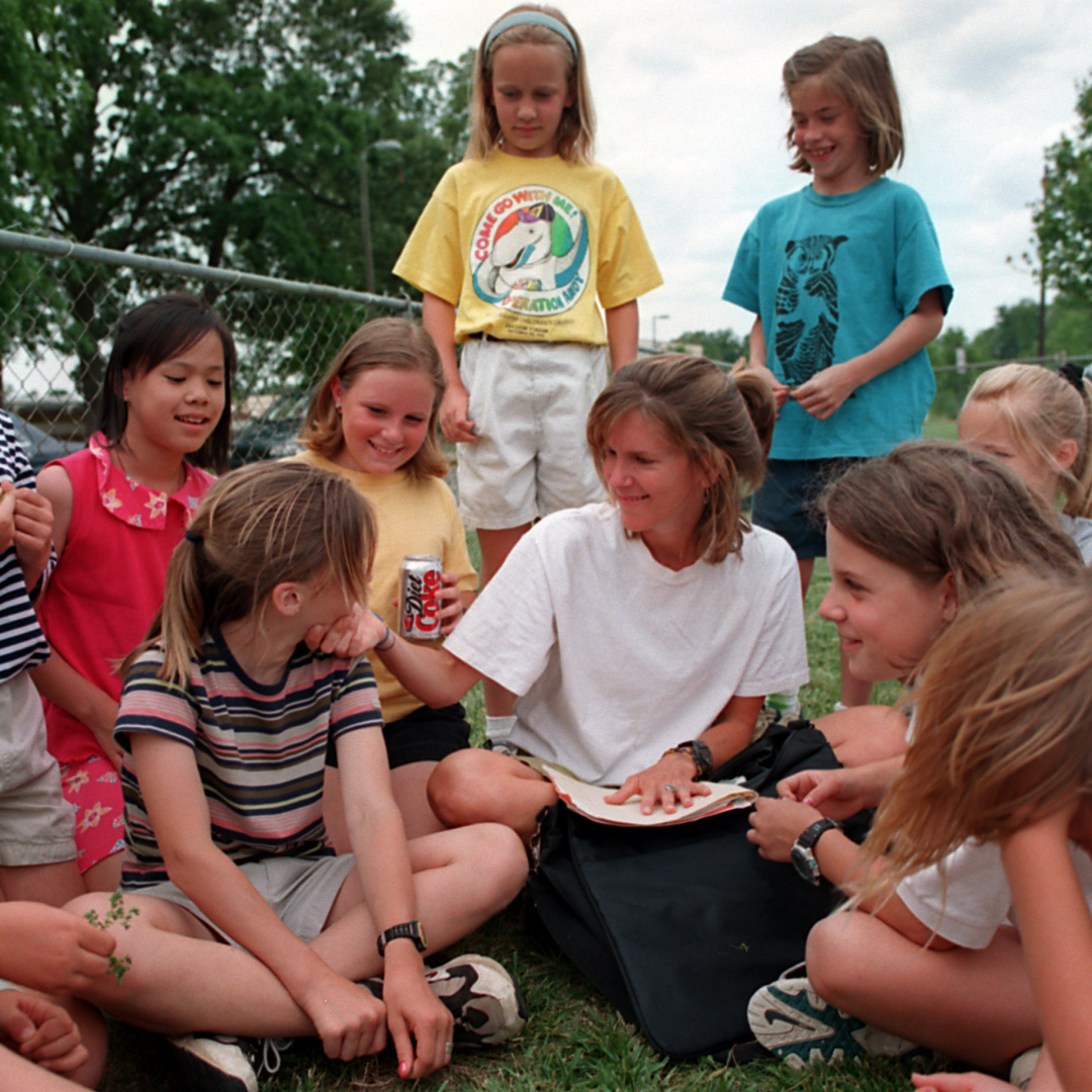 Molly Barker posing with 2 Girls on the Run participants.