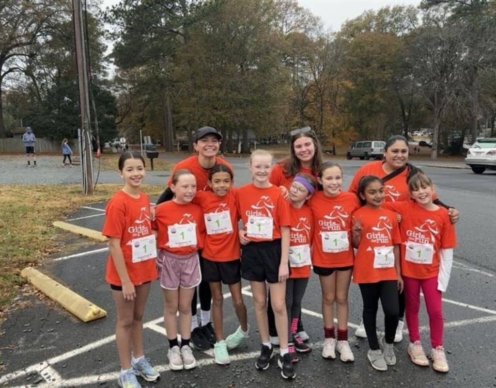Team from GOTR Union County posing with their coaches ahead of their 5K.